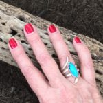 turquoise ring shown against natural dried cactus